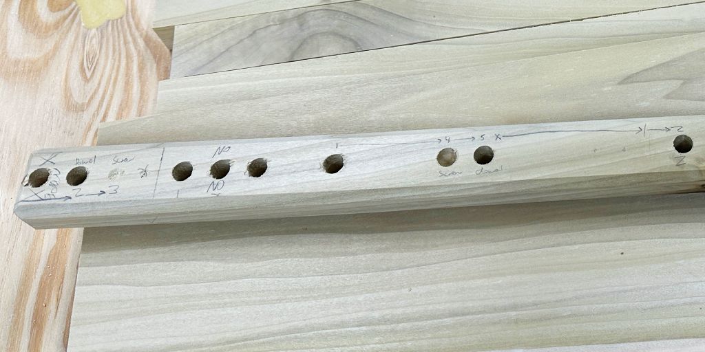 bookshelf diy drilling dowel pins story stick closeup